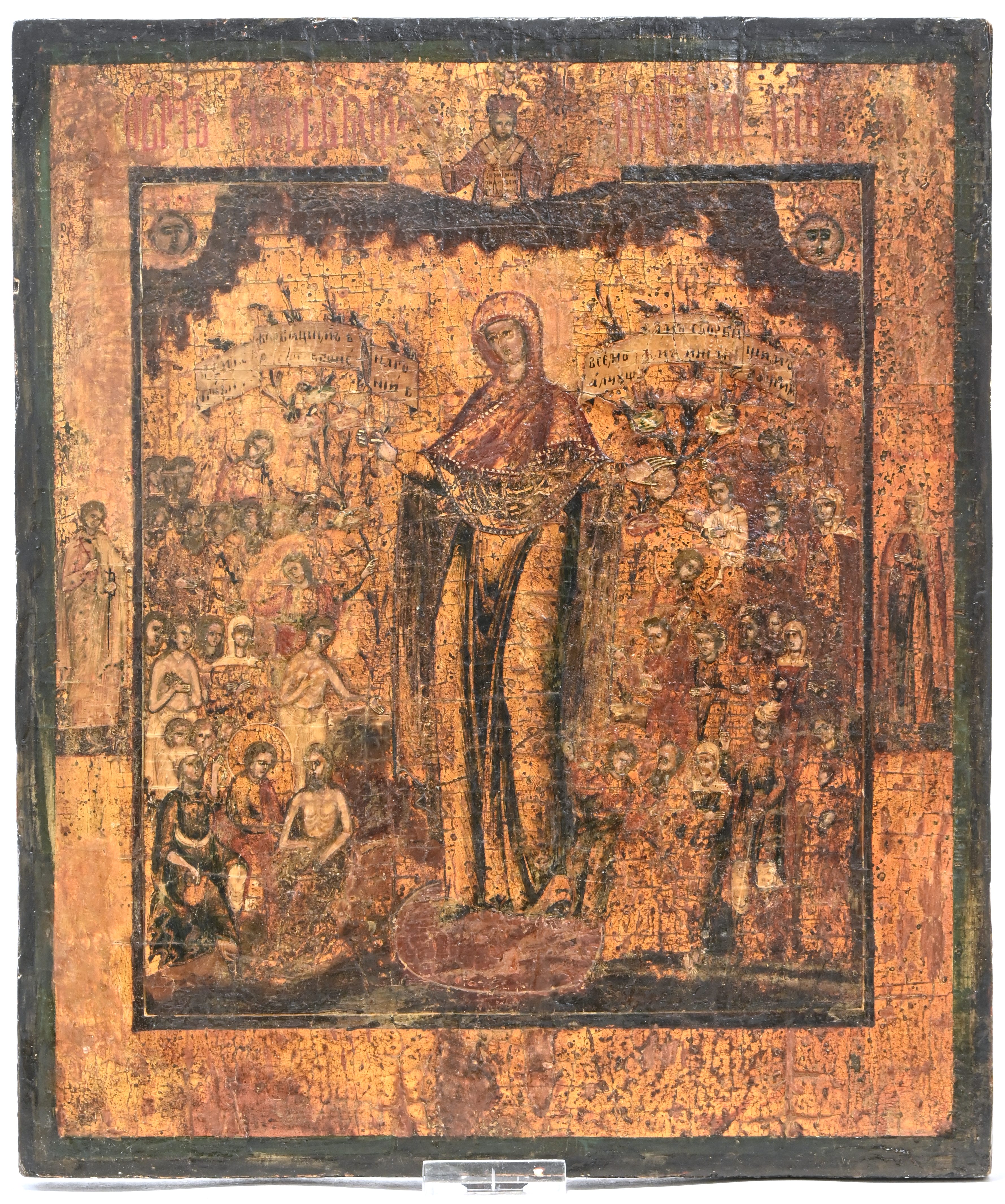 “Moeder van God, Troost van Alle Bedrukten. Met talrijke heiligen en martelaren”. Russische icoon. Tempera en zilververf op paneel, XIXde eeuw “Moeder van God, Troost van Alle Bedrukten. Met talrijke heiligen en martelaren”. Russische icoon. Tempera en zilververf op paneel, XIXde eeuw.