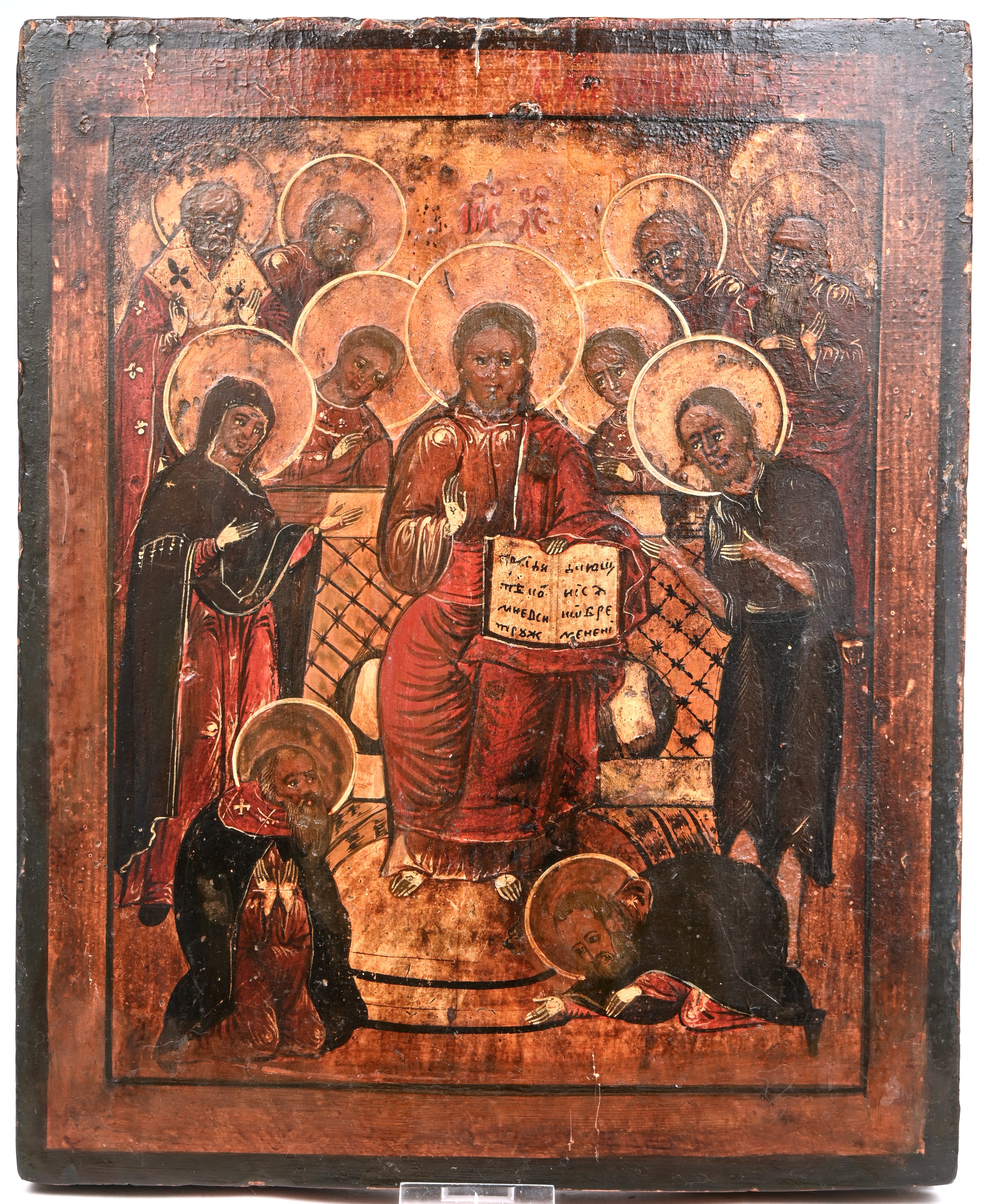“De getroonde Christus, omringd door talrijke heiligen”. Russische icoon. Tempera op paneel, XIXde eeuw “De getroonde Christus, omringd door talrijke heiligen”. Russische icoon. Tempera op paneel, XIXde eeuw.