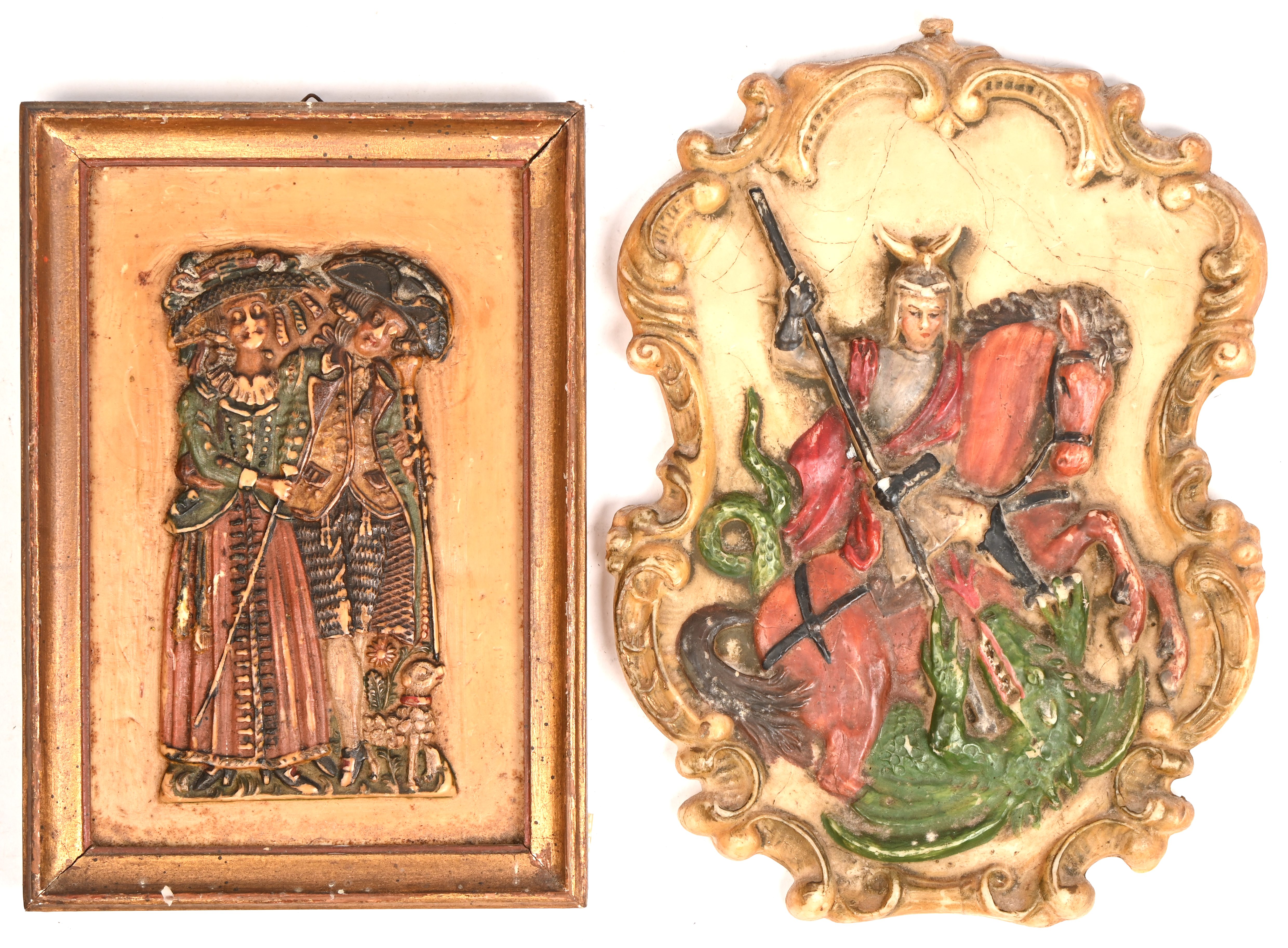 Twee wasreliëf plaquettes, Sint Joris en de draak en een koppel in houten kader Twee wasreliëf plaquettes, Sint Joris en de draak en een koppel in houten kader.