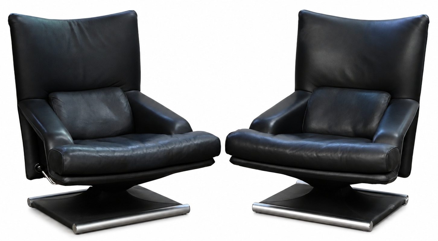 Een zwart lederen design salon bestaande uit 2 manuele relax-fauteauils en een driezit Een zwart lederen design salon bestaande uit 2 manuele relax-fauteauils en een driezit.