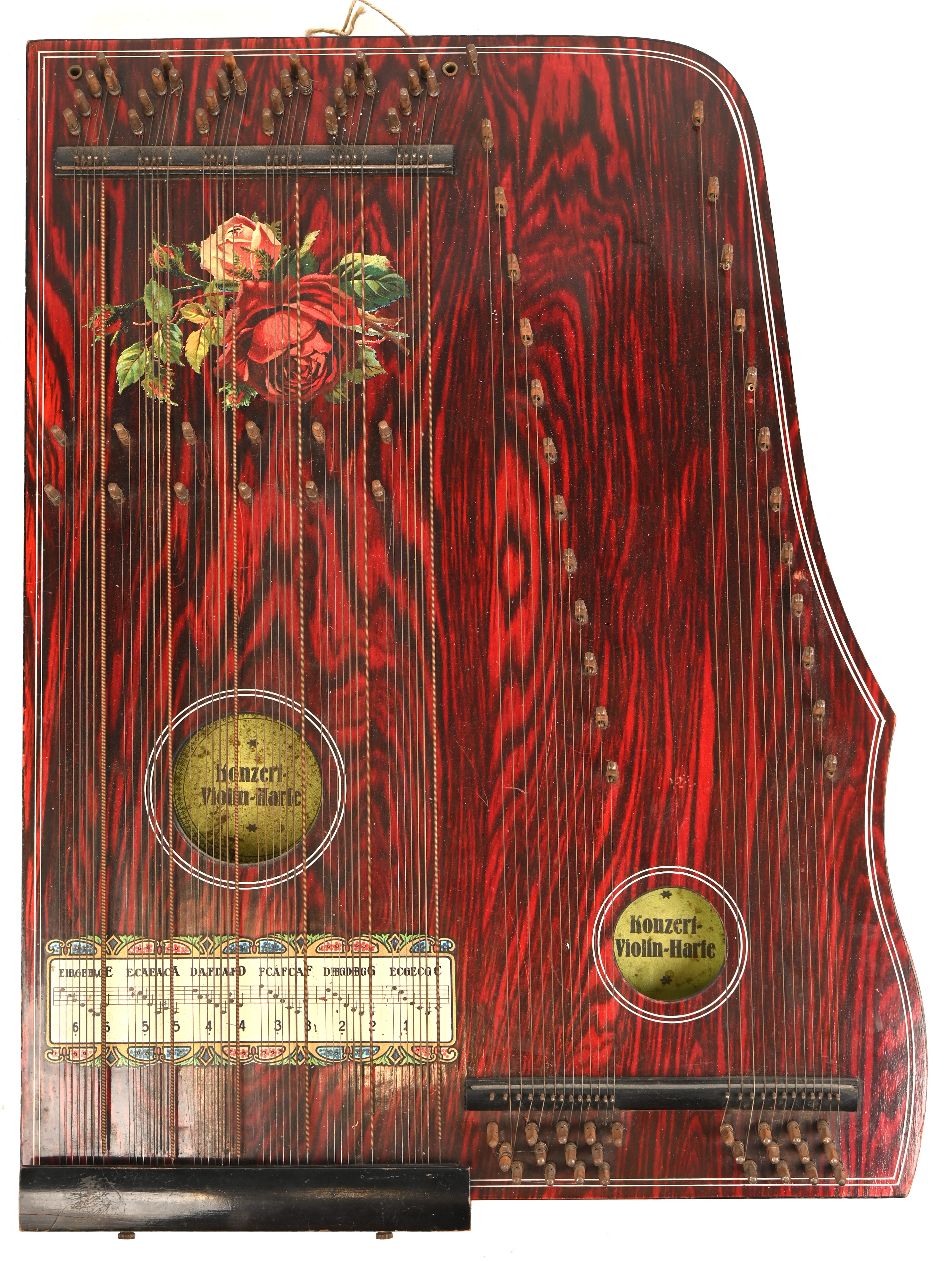 Een zither met label Konzert Violin-Harfe Een zither met label Konzert Violin-Harfe.