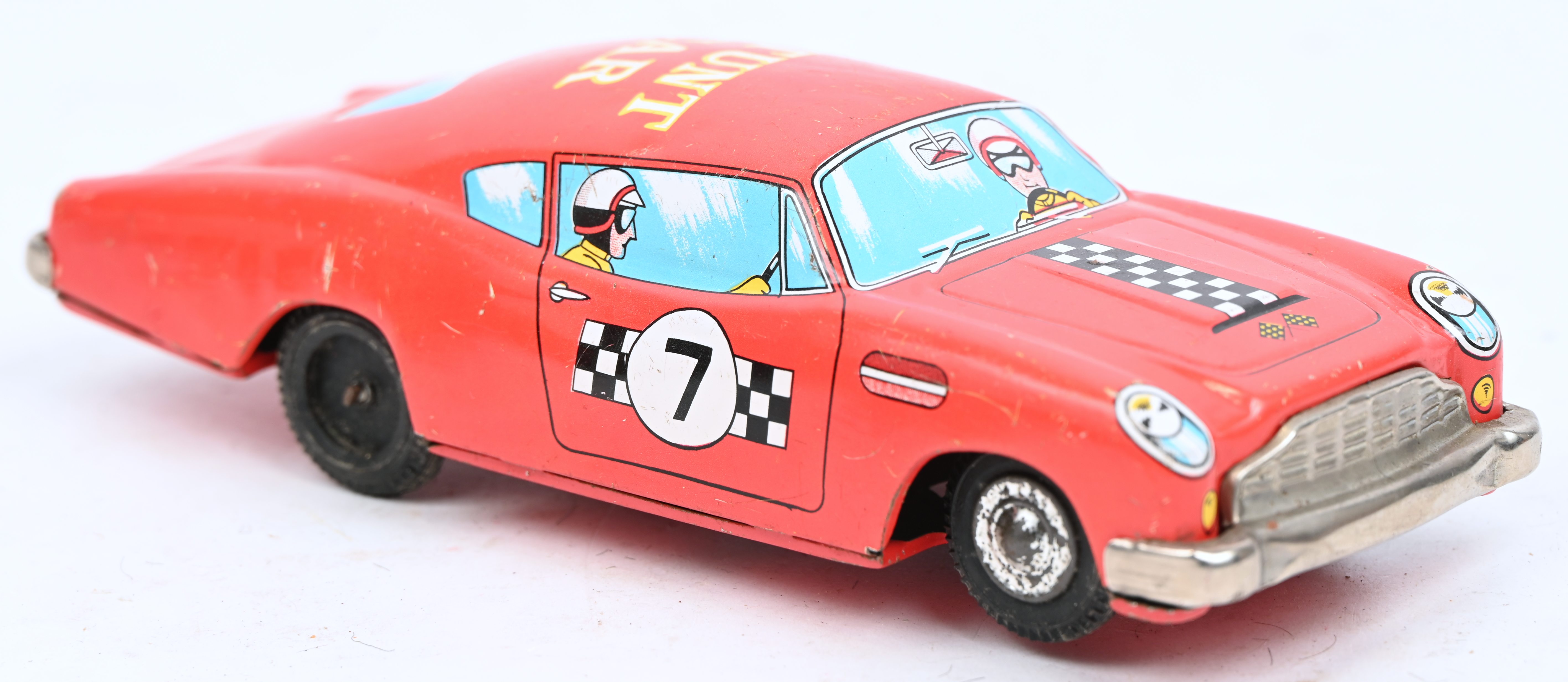 Een vintage opwindbare blikken Daiya stunt car, made in Japan Een vintage opwindbare blikken Daiya stunt car, made in Japan.